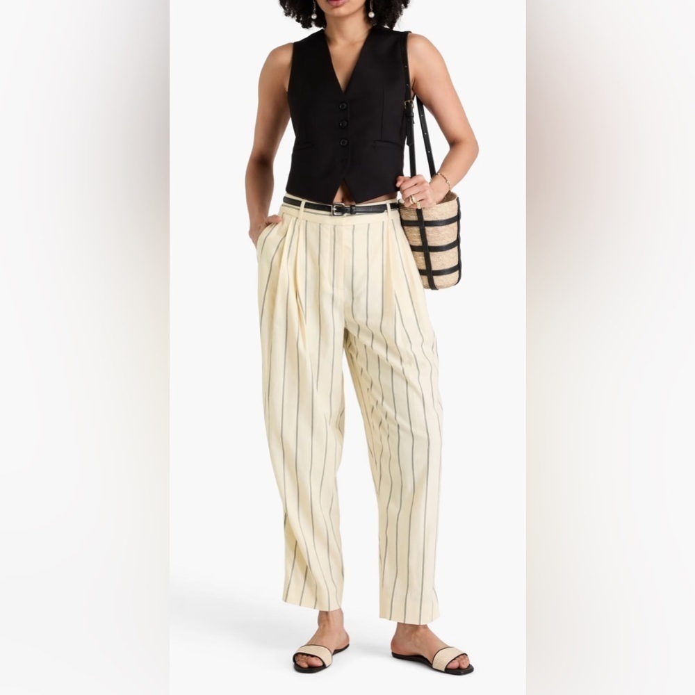 ZIMMERMANN
Pleated striped linen-blend tapered pants
$695